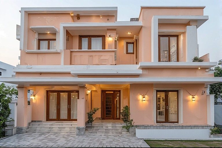 Pastel peach and white exterior colour combination for compact houses