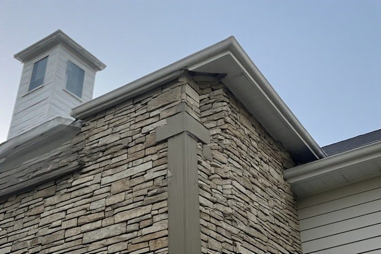 Stone look border parapet wall design.